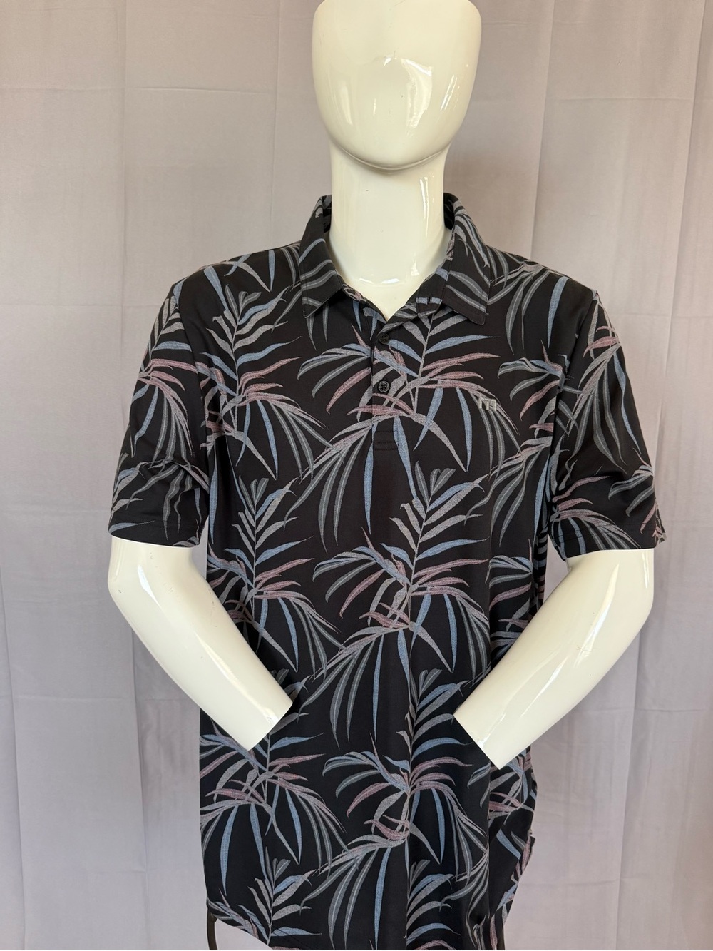 Travis Mathew Black Polo with Blue and Pink Tropical Leaf Print